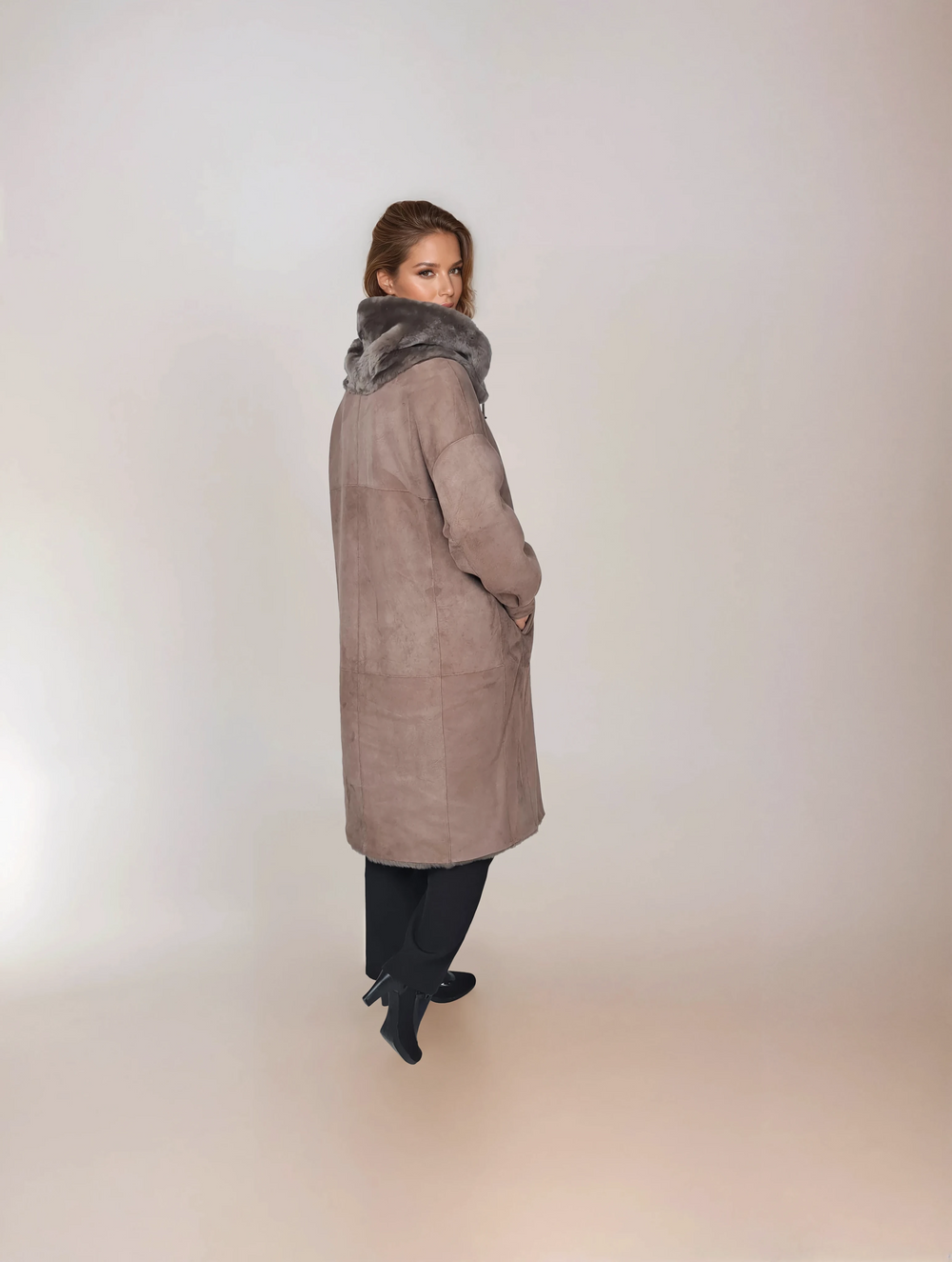 New Gabiana 108 cm Dark Oak suede lamb coat with fur-trimmed hood, back and side view on model